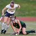 Saline's Amelia Waters collides with Huron's Keeley Erhardt during the first half at Saline on Thursday night. Melanie Maxwell I AnnArbor.com